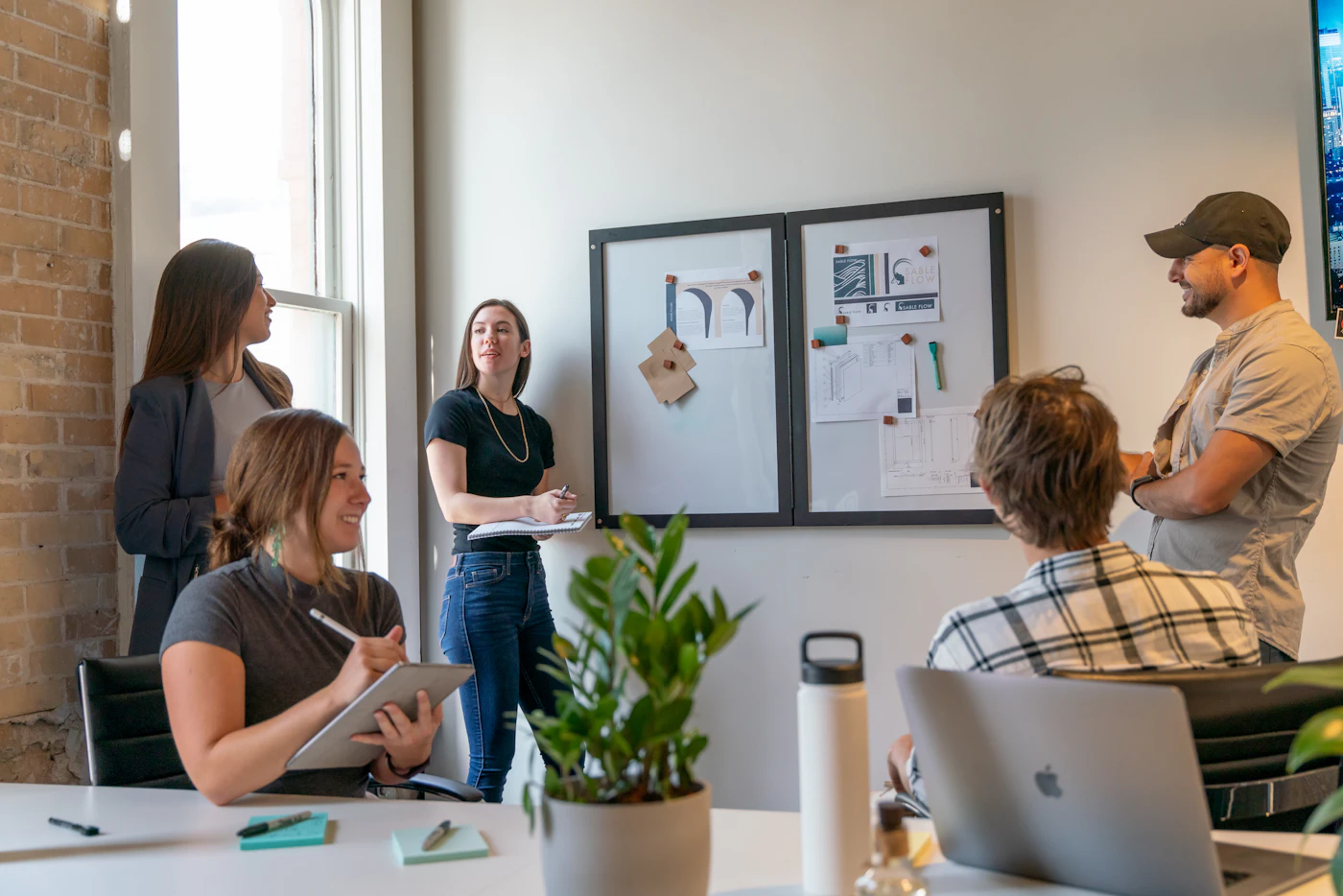 An agency team meeting in a bright office